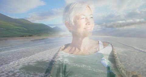 Senior Woman Reflecting Peacefully by Serene Coastline