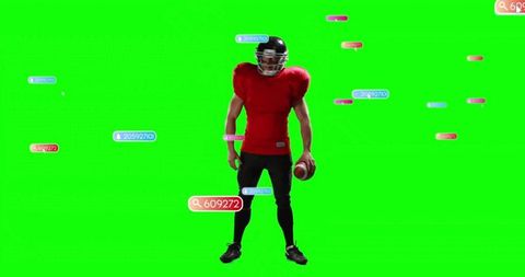 American football player holding ball in green screen studio