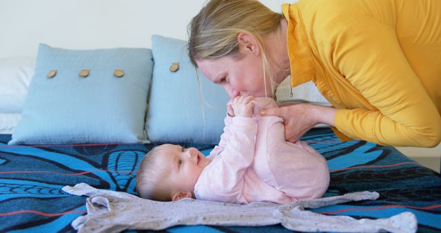 Mother Playing with Baby on Bed in Bright Room - Download Free Stock Images Pikwizard.com