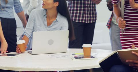 Diverse Professionals Collaborating in a Casual Office Meeting