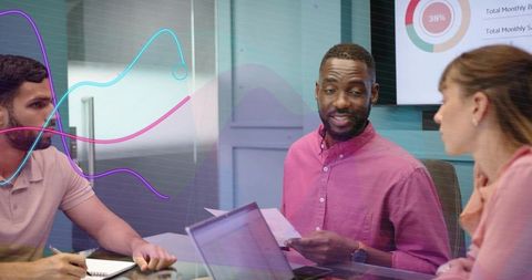 Business team discussing analytics while presenter holding report with digital dashboards