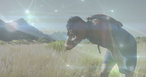 Network Overlay on Hiker Resting in Mountain Landscape