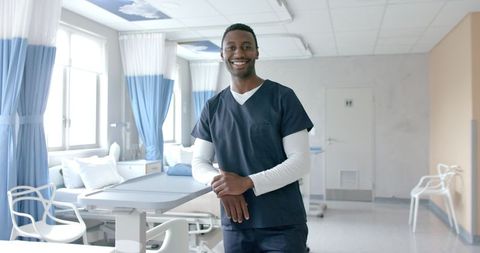 Confident African American Doctor Standing in Hospital Ward - Download Free Stock Images Pikwizard.com