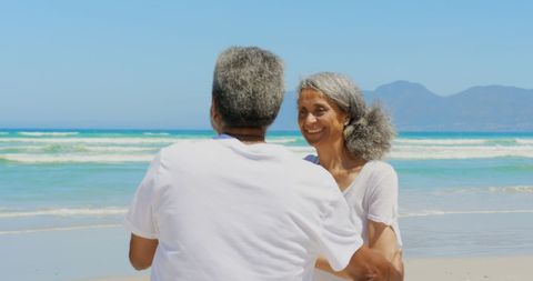Romantic Senior Couple Dancing Together on Sunny Beach - Download Free Stock Images Pikwizard.com