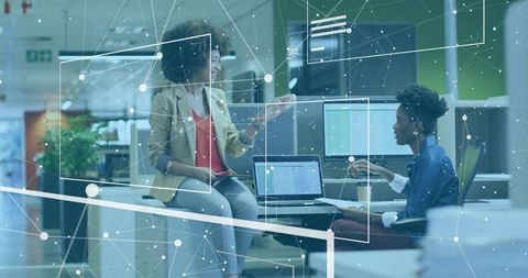 Coworkers Collaborating with Digital Network Overlay in Modern Office