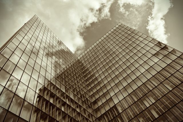 Modern Glass Skyscraper with Cloud Reflection in Seepia Tone - Download Free Stock Photos Pikwizard.com