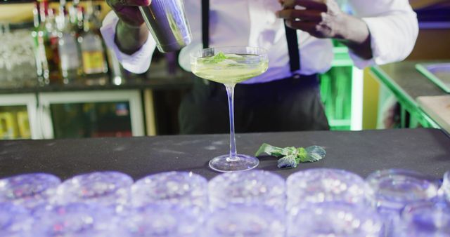 Image of midsection of african american barman preparing green cocktail at the bar - Download Free Stock Photos Pikwizard.com
