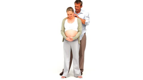 Supportive Husband Massaging Pregnant Wife at Home