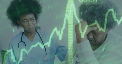 Nurse providing comfort and care to elderly patient in hospital setting