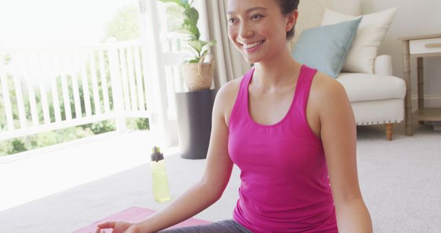 Smiling Woman Practicing Meditation at Home in Pink Tank Top - Download Free Stock Images Pikwizard.com