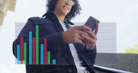 Young man analyzing data on smartphone for business insight