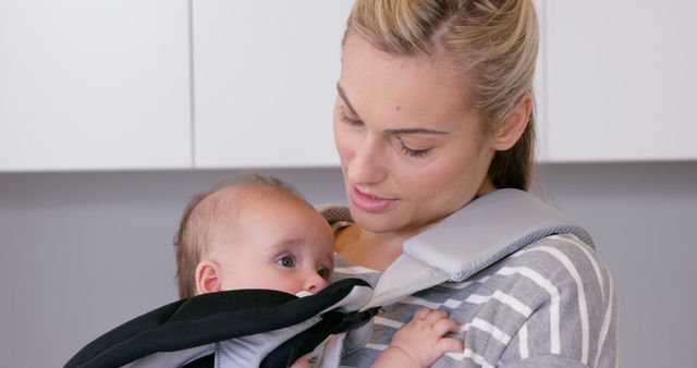 Mother Bonding With Baby In Carrier At Home - Download Free Stock Images Pikwizard.com