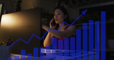 Businesswoman in Office Analyzing Financial Data Growth