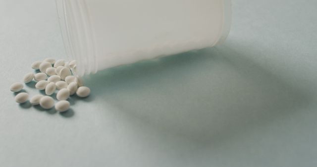 Image of close up of box of white pills on white background. global medicine and healthcare concept.