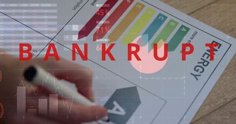 Bankrupt Warning Overlaying Energy Rating Certificate Being Marked with Black Marker