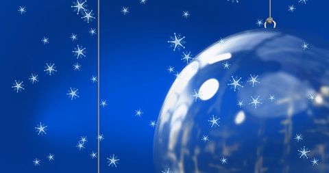 Shimmering Christmas Bauble with Snowflakes on Blue Painted Background - Download Free Stock Images Pikwizard.com