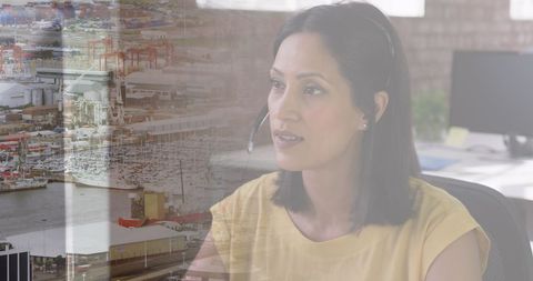 Focused Businesswoman Overlooking Busy Cityscape Collaboration