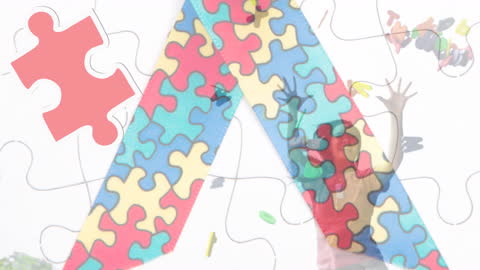 Autism Awareness Concept with Puzzle Ribbon Overlaid on Happy Woman