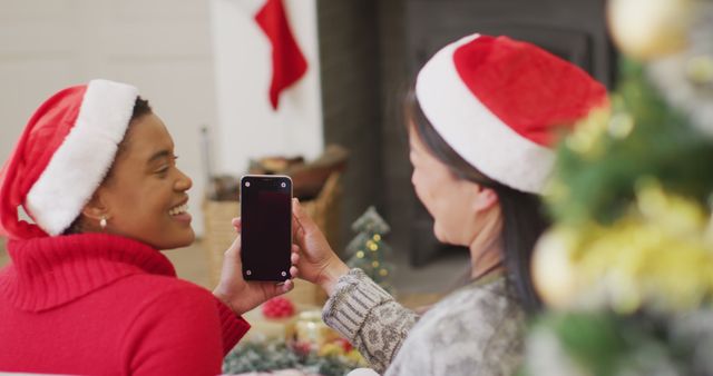 Happy Friends Taking Holiday Selfies by the Christmas Tree - Download Free Stock Images Pikwizard.com