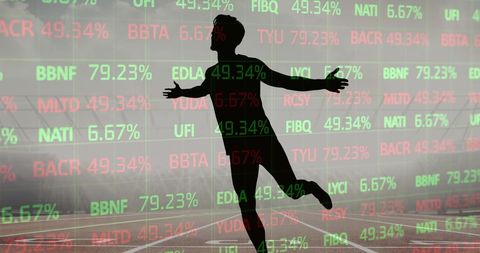 Silhouette of Celebrating Runner Overlaid with Stock Market Data