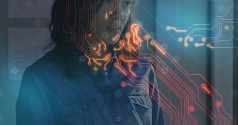 Tech professional analyzing circuitry overlay in innovative setting