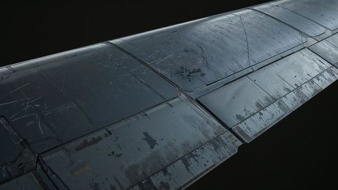 Close-up of weathered airplane wing panel showing rivets and chipped paint