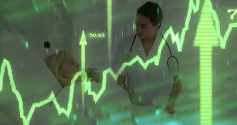 Nurse Monitoring Patient with Digital Vital Signs Display