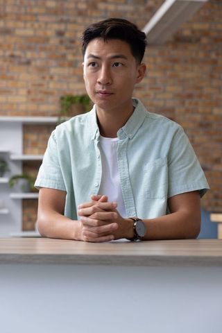 Professional man in contemporary office interior checking time