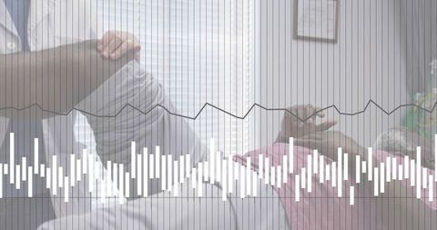 Clinician performing leg raise physical therapy with vital signs waveform overlay