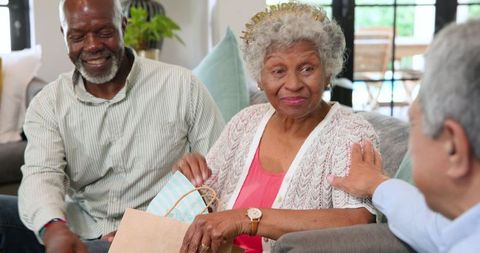 Happy Seniors Celebrating Birthday with Gifts