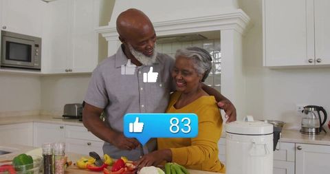 Smiling Mature Couple Preparing Vegetables Together in Modern Kitchen