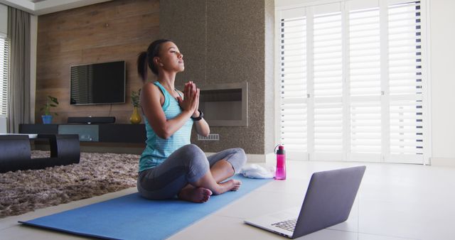 Woman Practicing Yoga Meditating at Home with Laptop - Download Free Stock Images Pikwizard.com