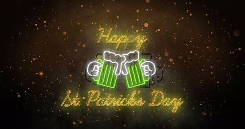 Neon happy st. Patrick's day sign clinking green beer mugs with gold bokeh