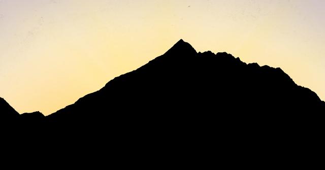 Digital composite of Silhouette mountain against sky during sunset