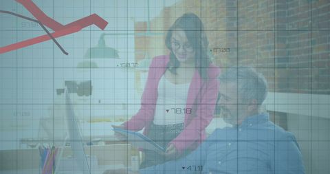 Colleagues discussing business analysis in modern office setting