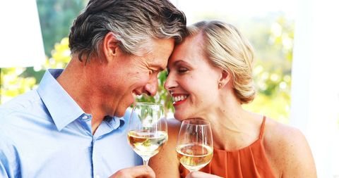 Joyful Mature Couple Toasting with White Wine During Lunch - Download Free Stock Images Pikwizard.com