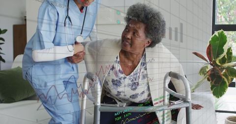 Caregiver assisting senior with walker in home setting