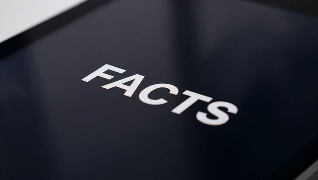 Displaying bold facts on glossy tablet screen close-up for fact-checking and media