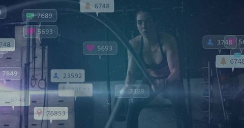 Female Athlete Training with Battle Ropes and Social Media Engagement