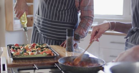 Couple Joyfully Cooking Healthy Meal Together in Cozy Kitchen