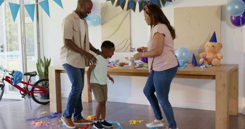 Diverse Family Celebrating Birthday with Joyful Playful Atmosphere