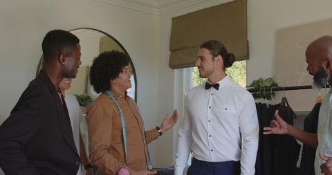 Groom and friends bonding before wedding ceremony