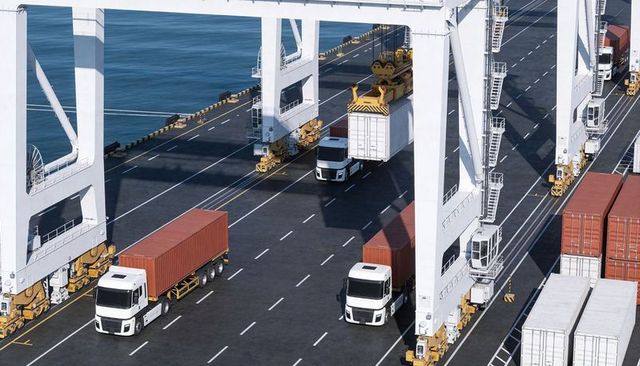 Container terminal operations with gantry cranes loading trucks at busy seaport quay