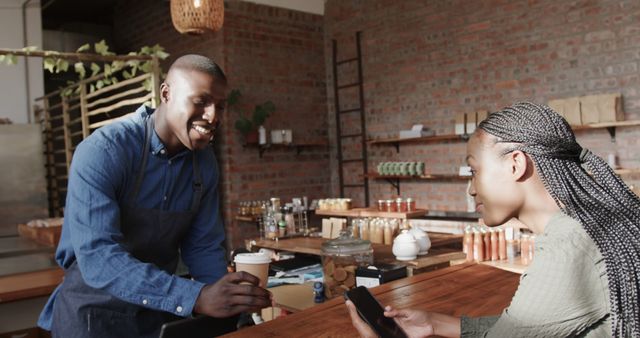 Smiling Barista Serving Coffee To Customer In Modern Cafe - Download Free Stock Images Pikwizard.com