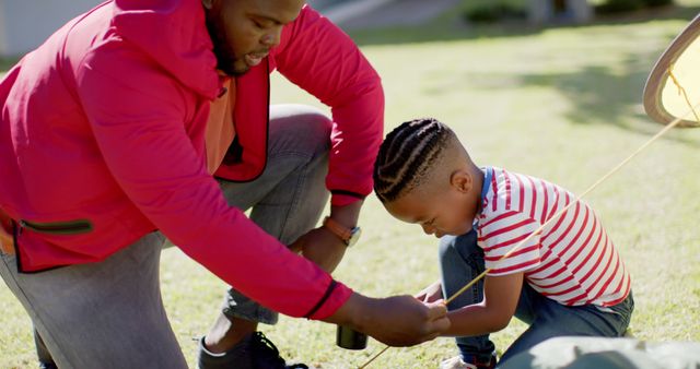 Father and Son Bonding While Building Kite Together Outdoors - Download Free Stock Images Pikwizard.com