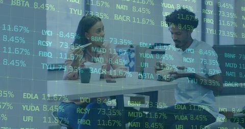 Colleagues analyzing stock data during meeting