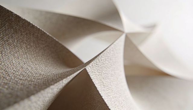 Abstract linen-textured paper loops and curves macro minimalist beige sculpture