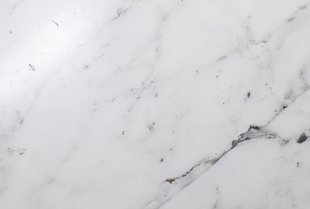 High-quality image of a white marble surface with subtle gray veins, perfect for use as a background in design projects. Ideal for websites, blogs, social media posts, and as a backdrop for presentations or other digital content. Suitable for design concepts related to luxury, elegance, and sophistication.