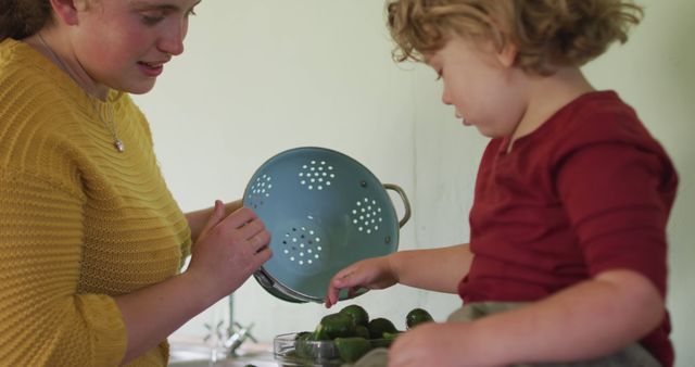 Mother and Child Cooking Together in Cozy Kitchen - Download Free Stock Images Pikwizard.com