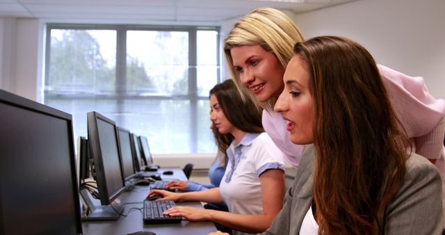 Team of Professional Women Collaborating in Office on Computers - Download Free Stock Images Pikwizard.com